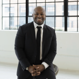 BrightMind Consulting Group CEO Jevon Wooden in a black suit